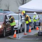 Volunteers help check in patients and provide information at the Jamestown Family Health Clinic vaccination event on Feb. 4 at Trinity United Methodist Church and Carrie Blake Community Park. Sequim Gazette photo by Michael Dashiell