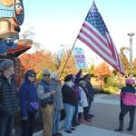 About a dozen people gather by the totem pole donated by the Jamestown SKlallam Tribe on Oct. 28, 2019 in support of the tribes proposed MAT clinic. The group, calling itself Voices for Health and Healing, sang hymns next to a large group of members of Save Our Sequim who oppose the MATs location near businesses. Sequim Gazette file photo by Matthew Nash