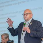 Jamestown SKlallam Tribe Chair and CEO Ron Allen addresses a crowd of about 1,300 people during the tribes town hall meeting concerning its planned medicine-assisted treatment facility in Sequim on Aug. 8, 2019. Jesse Major/Peninsula Daily News