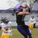 Sequim senior receiver Michael Young, right, hauls in a 34-yard pass from Kobe Applegate in the second half of Sequims shutout win over Bainbridge on Feb. 20. Sequim Gazette photo by Michael Dashiell