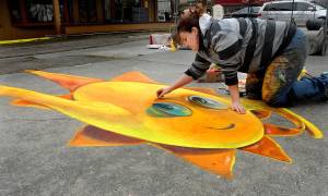 West Seattle chalk artist Naomi Haverland creates a 3D chalk drawing that changes shape based upon perspective at Centennial Place in downtown Sequim on Saturday during the weekends Sequim Sunshine Festival in 2020. File photo by Keith Thorpe/Olympic Peninsula News Group