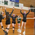 Sequim players celebrate a set victory as they take on Port Angeles at home on Feb. 25. Sequim edged the Roughriders in four sets. Sequim Gazette photo by Michael Dashiell