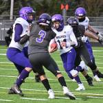 North Kitsap defenders chase after Sequim quarterback Kobe Applegate in the first half of the Vikings 28-0 rout of their Olympic League rivals in Poulsbo on Feb. 27. Sequim Gazette photo by Michael Dashiell