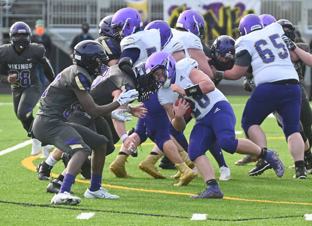 Sequim running back Blake Peterson looks for running room late in the second half of the Wolves 28-0 loss at North Kitsap on Feb. 27. Sequim Gazette photo by Michael Dashiell