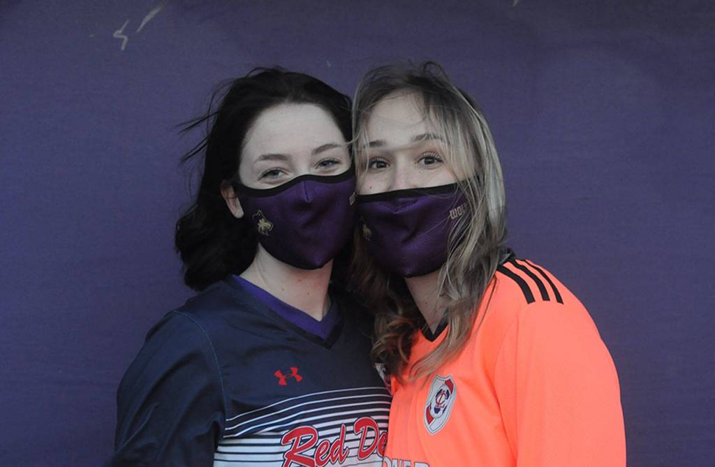 Sequim High School seniors Abby Schroeder, left, and Oliva Hare signed letters of intent to play at Lower Columbia College last week. Sequim Gazette photo by Michael Dashiell