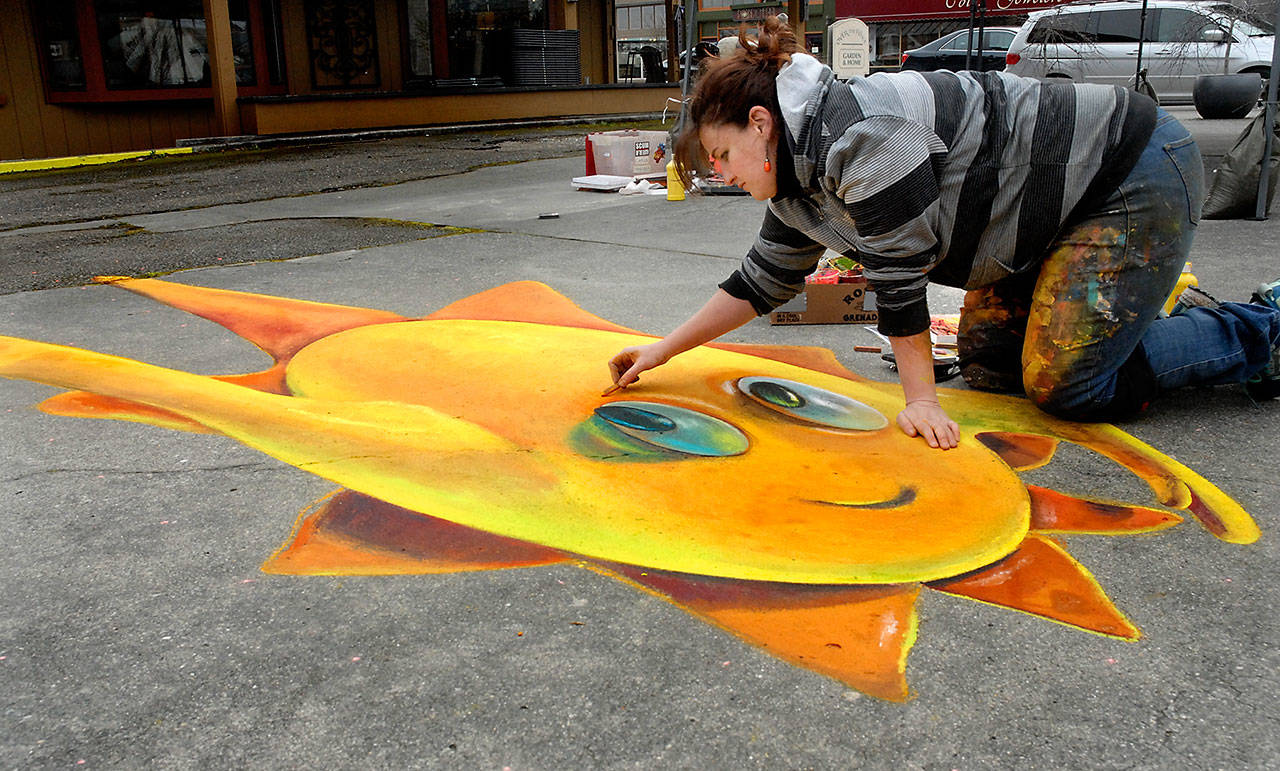 West Seattle chalk artist Naomi Haverland creates a 3D chalk drawing that changes shape based upon perspective at Centennial Place in downtown Sequim on Saturday during the weekends Sequim Sunshine Festival in 2020. File photo by Keith Thorpe/Olympic Peninsula News Group