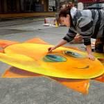 West Seattle chalk artist Naomi Haverland creates a 3D chalk drawing that changes shape based upon perspective at Centennial Place in downtown Sequim on Saturday during the weekends Sequim Sunshine Festival in 2020. File photo by Keith Thorpe/Olympic Peninsula News Group