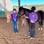 At left, Susannah Sharp, with Sunny, and Keri Tucker, with Nikki, prepare for the showmanship competition as Sequim Equestrian Team members compete in the first district meet of the season in late February in Elma. Tucker placed fourth and Sharp was 13th in the event. Submitted photo