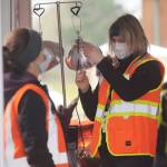 Nurse Charissa Decker prepares a vaccination shot at the Jamestown Family Health Clinic vaccination drive-thru clinic on Feb. 4. Sequim Gazette photo by Michael Dashiell