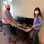 Ted Shanks, president of the Noon Rotary Club of Sequim, and Mary Budke, CEO of the Boys & Girls Clubs of the Olympic Peninsula (and Sequim noon Rotarian), show some of the recently donated equipment at the Turner Unit in Port Angeles. Submitted photo