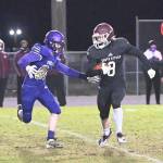 Sequims Jonas Welch, left, looks to tackle South Kitsap receiver Jayden Armstrong late in the second half of the Wolves 27-15 win over South Kitsap on March 5. Sequim Gazette photos by Michael Dashiell