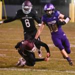 Sequim senior Garrett Hoesel, right, picks up 54 yards on a punt return in the first half of Sequims 27-15 home win over South Kitsap on March 5.
