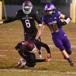 Sequim senior Garrett Hoesel, right, picks up 54 yards on a punt return in the first half of Sequims 27-15 home win over South Kitsap on March 5.