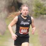 Sequim junior Riley Pyeatt holds an early lead as she helps the Wolves with a one-point win over Klahowya at Voice of America Park on March 6, Sequims lone home meet of the abbreviated 2021 season. Sequim Gazette photo by Michael Dashiell
