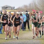 Sequim and Klahowya girls cross country teams break from the starting line at Voice of America Park in Sequim on March 6. Sequim edged the visiting Eagles by a point, 27-28 (low score wins). Sequim Gazette photo by Michael Dashiell