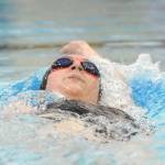 Sequims Sydnee Price competes in the 100 backstroke in the Wolves final regular season meet on March 5. Sequim Gazette photos by Michael Dashiell