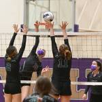 Sequims Kendall Hastings looks to hit past Klahowya defenders Alyssa Hintz (2) and Aleah Catt in the Wolves league win at home on March 8. Sequim Gazette photo by Michael Dashiell