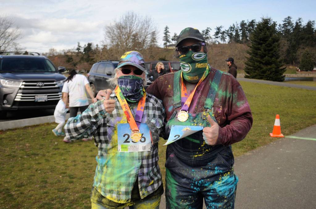 Vicki McCurdy and Tim MacDonald celebrate finishing the 1k Sun Fun Color Run in Carrie Blake Community Park on 
March 6. It was McCurdys second time participating 
and MacDonalds first. 
Sequim Gazette photo by Matthew Nash