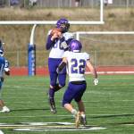 With teammate Walker Ward looking on, Sequim defensive back Isaiah Moore (80) picks off an errant Olympic pass in the second half of the Wolves 21-12 loss at Olympic on March 13. Sequim Gazette photo by Michael Dashiell