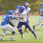 Sequim receiver Jonas Welch looks for more yardage in the first half of Sequims match-up with Olympic on March 13. Sequim Gazette photo by Michael Dashiell