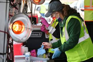 Volunteer nurse Michelle Grinnell preps COVID-19 vaccination doses at the Jamestown Family Health Clinic drive-thru clinic in Sequim on March 4. Sequim Gazette photo by Michael Dashiell
