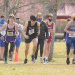 Sequim High junior Henry Hughes (50) and other runners break from the starting line at the Olympic League championship race on March 13 at Battle Point Park on Bainbridge Island. Sequim Gazette photo by Michael Dashiell