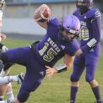 Sequim quarterback Taig Wiker dives in for a 6-yard touchdown in the first half of the Wolves 38-22 win over Central Kitsap on March 18. Wiker rushed for 130 yards and two scores, and threw for another 166 yards and a touchdown. Sequim Gazette photo by Michael Dashiell