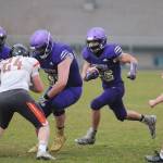 Sequim running back Walker Ward gets some key blocking from Brandon Barnett (55) in the first half of Sequims season finale against Central Kitsap on March 18. Ward had 62 yards in the 38-22 victory. Sequim Gazette photo by Michael Dashiell
