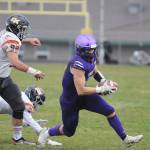 Sequim receiver Michael Young takes a sweep and eyes yardage in the first half of the Wolves March 18 win over visiting Central Kitsap. Young had two key interceptions  one for a touchdown  in the win. Sequim Gazette photo by Michael Dashiell