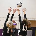 Sequim senior Jayla Julmist hits past Central Kitsaps Baylee Anderson (1) and Becca Roy in the Wolves four-set win over the visiting Cougars on March 20. Sequim Gazette photo by Michael Dashiell