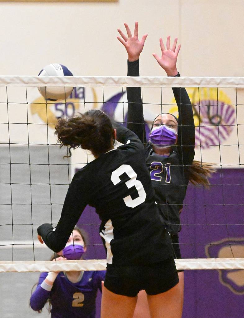 With teammate Allie Gale looking on, Sequims Kalli Wiker (21) tries to block Central Kitsaps Allie Baldridge in a league crossover match on March 20. Sequim Gazette photo by Michael Dashiell