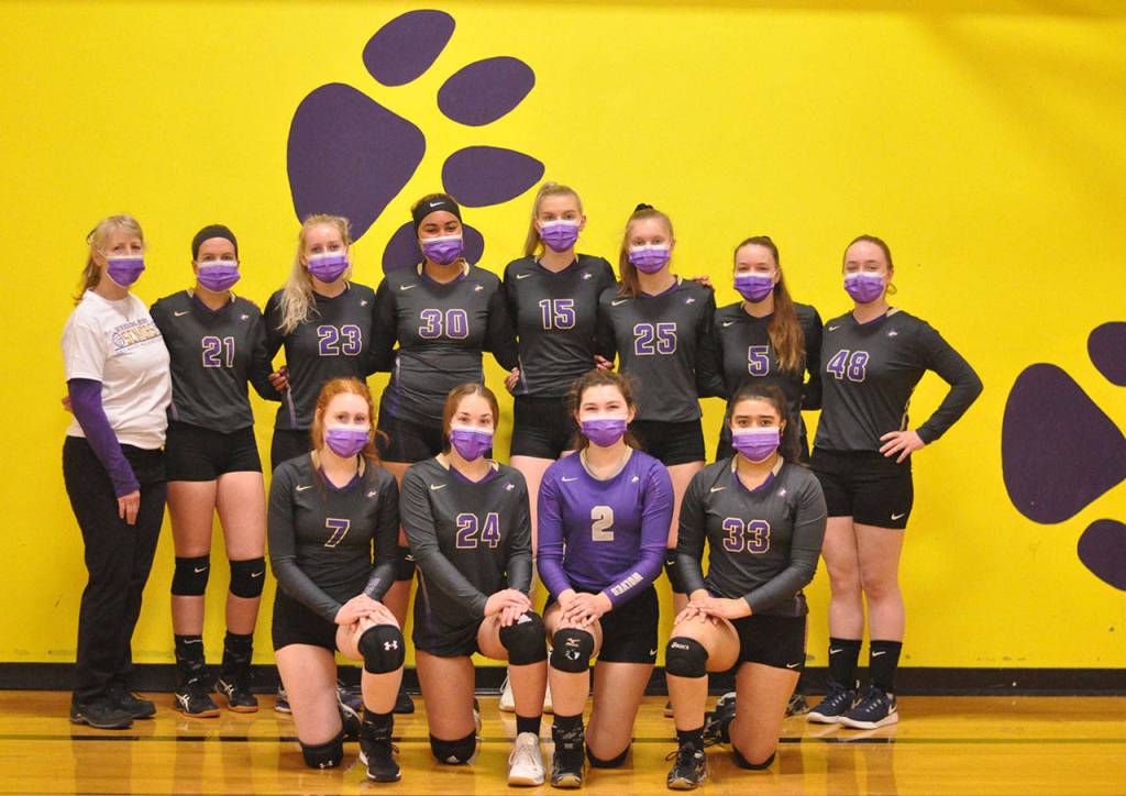 Sequim Highs varsity volleyball squad is all smiles after a league crossover victory against Central Kitsap on March 20. They include (back row, from left) head coach Jennie Webber Heilman, Kalli Wiker, McKenna Hastings, Jayla Julmist, Kendall Hastings, Jolene Vaara, Amanda Weller and Malory Morey, with (front row, from left) Kelsi Bergeson, Jordan Hegtvedt, Allie Gale and Jessica Asselin. Not pictured: Lindsay Swanson. Photo by Wendy Morey