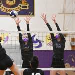 Sequims Jolene Vaara (25) and Kendall Hastings look to put a block on Central Kitsaps Camryn Lingenbrink in an Olympic League crossover match on March 20 in Sequim.