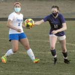 Olympics Alexis Valenzuela, left, and Sequims Abigail Schroeder chase after a loose ball during a March 16 match at Sequim High School. Photo by Keith Thorpe/Olympic Peninsula News Group