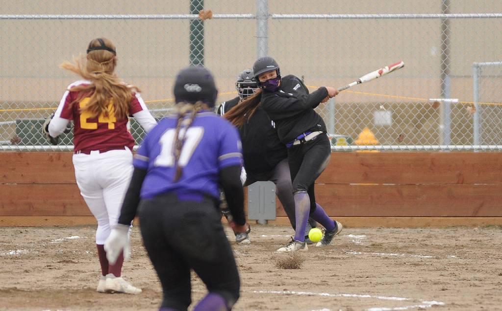 Sequims Kiana Robideau slaps a run-scoring single in the Wolves win over Kingston March 24. Sequim Gazette photo by Michael Dashiell