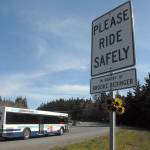 A sign honoring Brooke Bedinger, who was killed on her motorcycle near the spot, stands on the side of U.S. Highway 101 near Morse Creek east of Port Angeles. (Keith Thorpe/Peninsula Daily News)