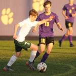 Port Angeles Kaleb Gagnon, left, looks to advance the ball in Sequim territory as the Wolves Eli Gish defends in a March 25 match. Gish scored in the first half  his sixth goal in the seasons first two games  as the Wolves shut out the Riders, 2-0. Sequim Gazette photo by Michael Dashiell