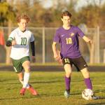 Sequims Eli Gish, right, looks for a teammate as Port Angeles Damon Gunderson defends in a March 25 match in Sequim. Gish scored in the first half  his sixth goal in the seasons first two games  as the Wolves shut out the Riders, 2-0. Sequim Gazette photo by Michael Dashiell
