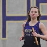 Left: Sequims Koda Robinson competes in the 4x400 relay in the Wolves season-opening meet against Olympic on March 24. Right: Sequims Hiilei Robinson competes in the 4x400 relay in the same meet. Sequim Gazette photos by Michael Dashiell