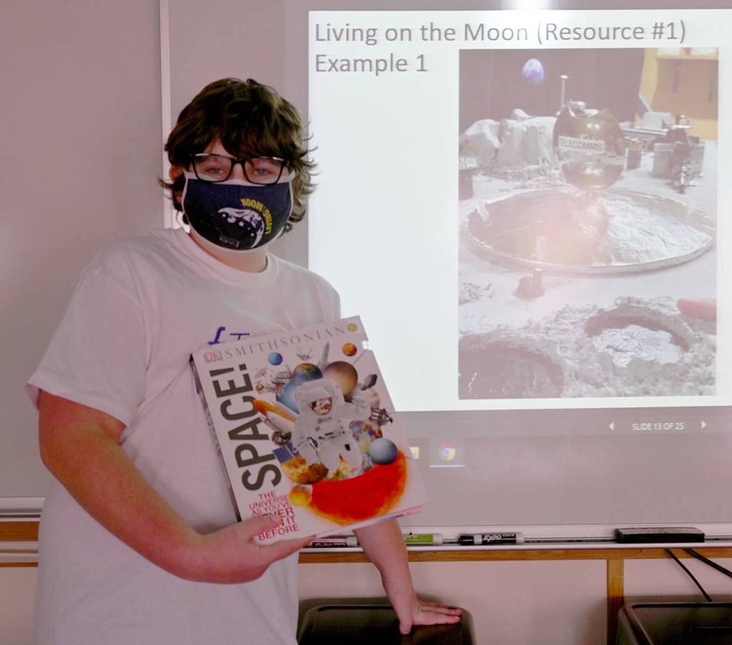 Olympic Peninsula Academy seventh-grader Louden Yates displays the project he and Ariya Goettling worked on for this years 2020-2021 Future City competition. Their Team Pandora earned a competition safety award and the pair received Space! books. Sequim Gazette photo by Michael Dashiell
