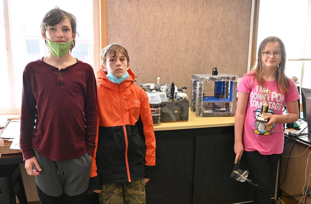 Olympic Peninsula Academy sixth-graders (from left) Mica McCarter, Donovan Rynearson and Katerina Abken display their Future City 2020-2021 competition model. Their Team Mellontikos took fifth place in a regional competition earlier this year. Sequim Gazette photo by Michael Dashiell