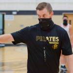 Donald Rollman, Peninsula Colleges head mens basketball coach, talks with players at a preseason practice. The Pirates open play on March 31. Photo courtesy of Peninsula College