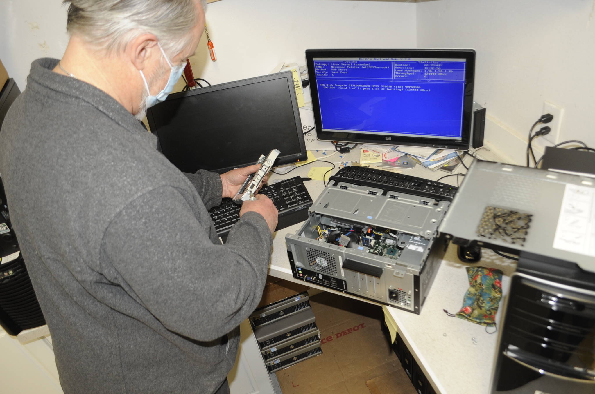 Al Lynn, a volunteer with the Sequim PC Users Group, is one of several people refurbishing computers to give to those in-need of a computer. Sequim Gazette photo by Matthew Nash