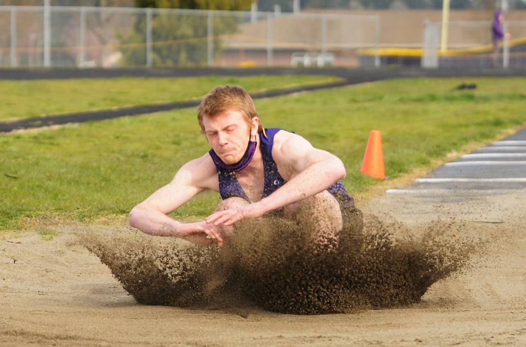 Sequims Logan Laxson earns a first place finish in the long jump with a personal best 19 feet, 9 inches, at the March 31 dual home meet against Port Angeles. Sequim Gazette photo by Michael Dashiell