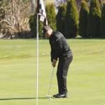 Sequims Truman Nestor Hoesel lines up a putt on the first hole at The Cedars at Dungeness on April 8. Sequim Gazette photo by Michael Dashiell