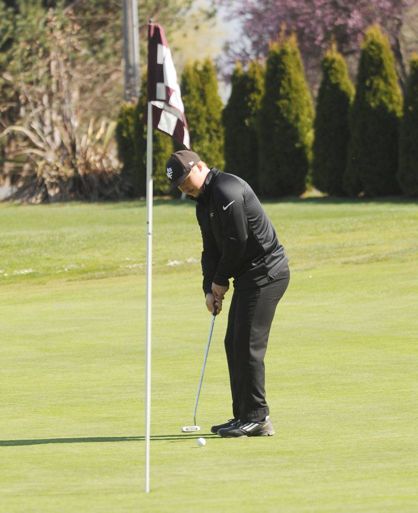 Sequims Truman Nestor Hoesel lines up a putt on the first hole at The Cedars at Dungeness on April 8. Sequim Gazette photo by Michael Dashiell