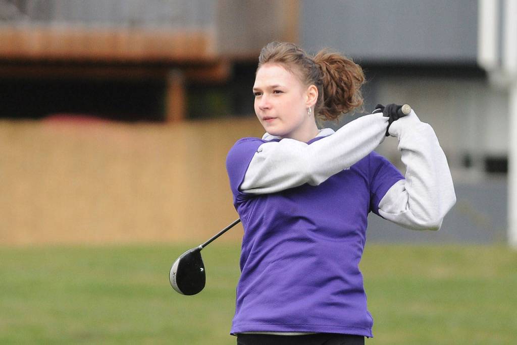 Sequims Juliana Tamblyn watches her drive from the third hole tee at The Cedars at Dungeness on April 8. Sequim Gazette photo by Michael Dashiell