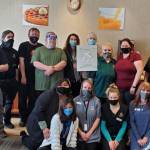 Staff with the Quality Inn & Suites at the Olympic National Park gather to commemorate receiving the Platinum Award for being among their franchises top 3 percent in customer satisfaction. Submitted photo