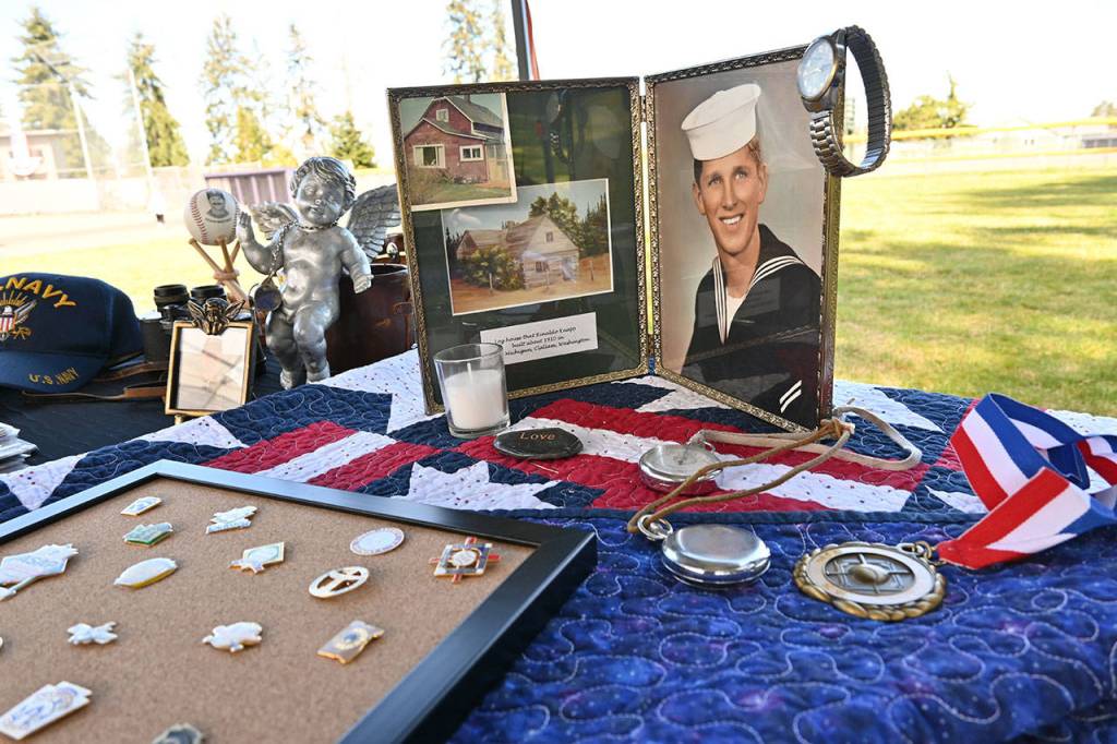 Photos, medals and other pieces of family history of longtime Sequim youth sports volunteer Don Knapp are on display at a memorial and Little League fundraiser on April 11. The event honored Knapp, who volunteered as a coach and in various roles for local youth sports before his death in November 2020. Sequim Gazette photos by Michael Dashiell