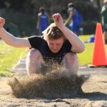 Sequims Logan Laxson leaps to a personal-best 20 feet in the long jump to take first place in a four-team meet in Port Angeles on April 14. Sequim Gazette photos by Michael Dashiell